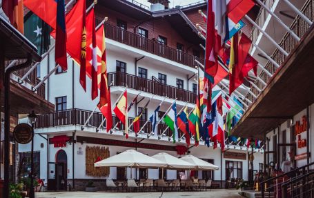 flags of various countries hanging 30 degree inclined from an admin office