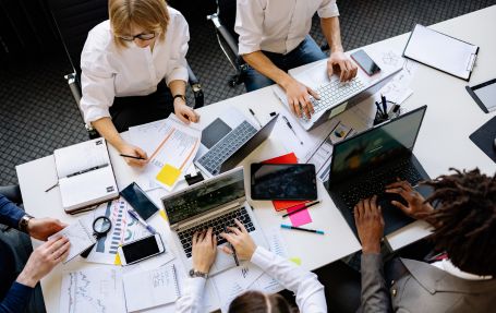 professionals working on their laptops displaing workplace mobility
