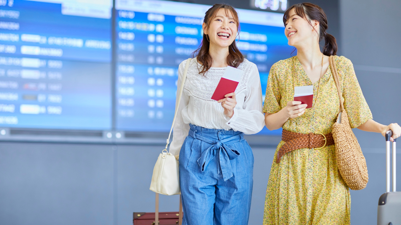Student reviewing travel documents at the airport