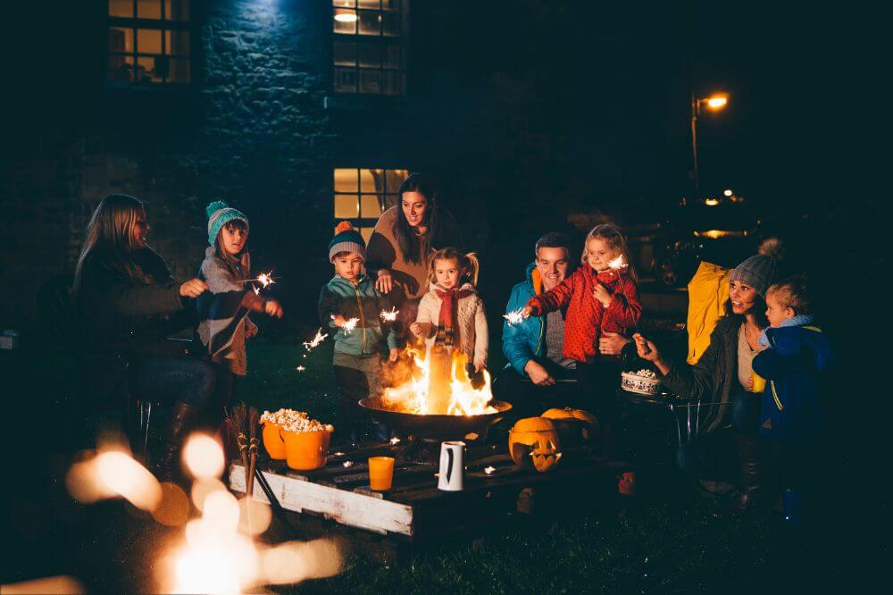 An image of a bonfire night gathering with neighbours and children. 