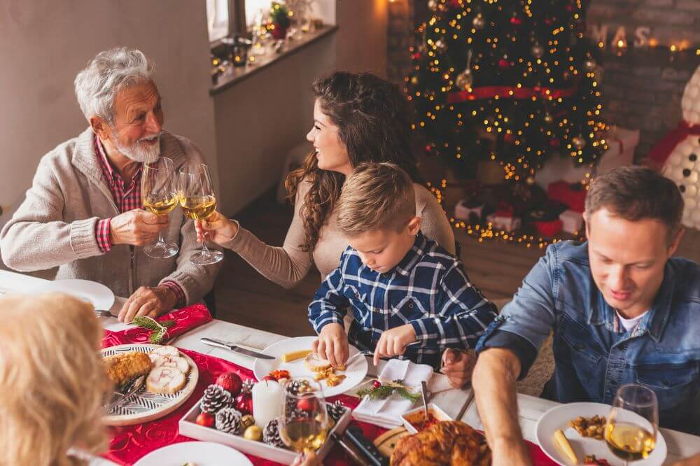 Family gathered together at Christmas, enjoying Christmas dinner. 