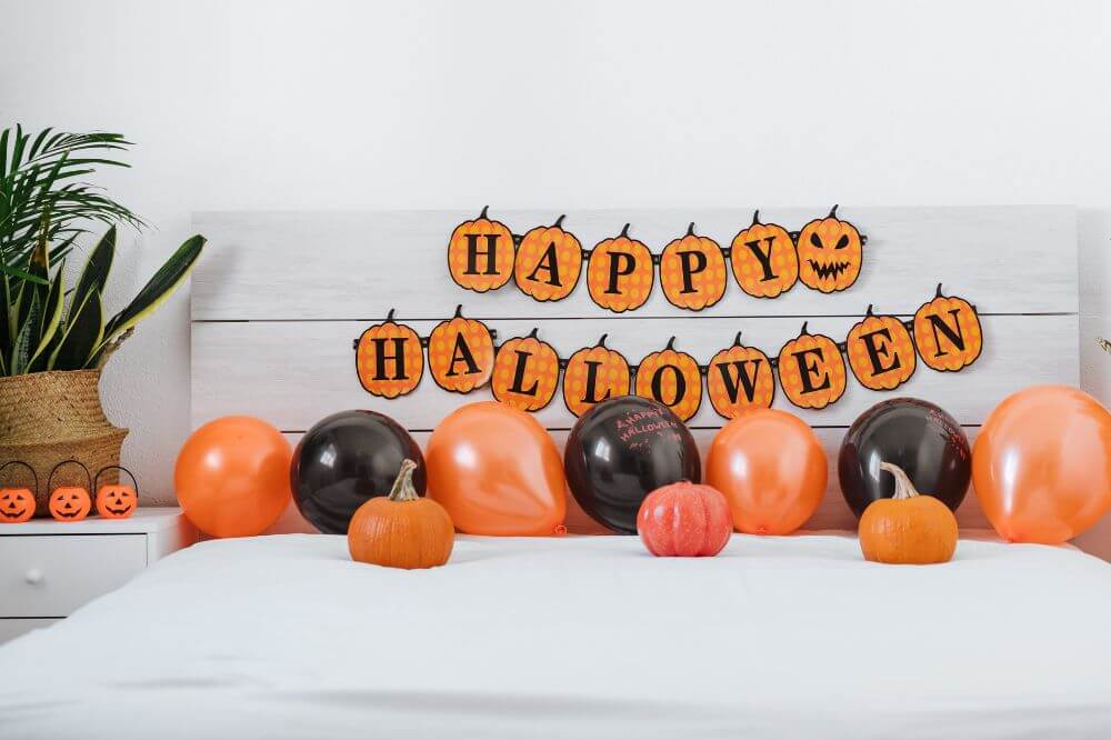 An image showing a bedroom decorated for Halloween 