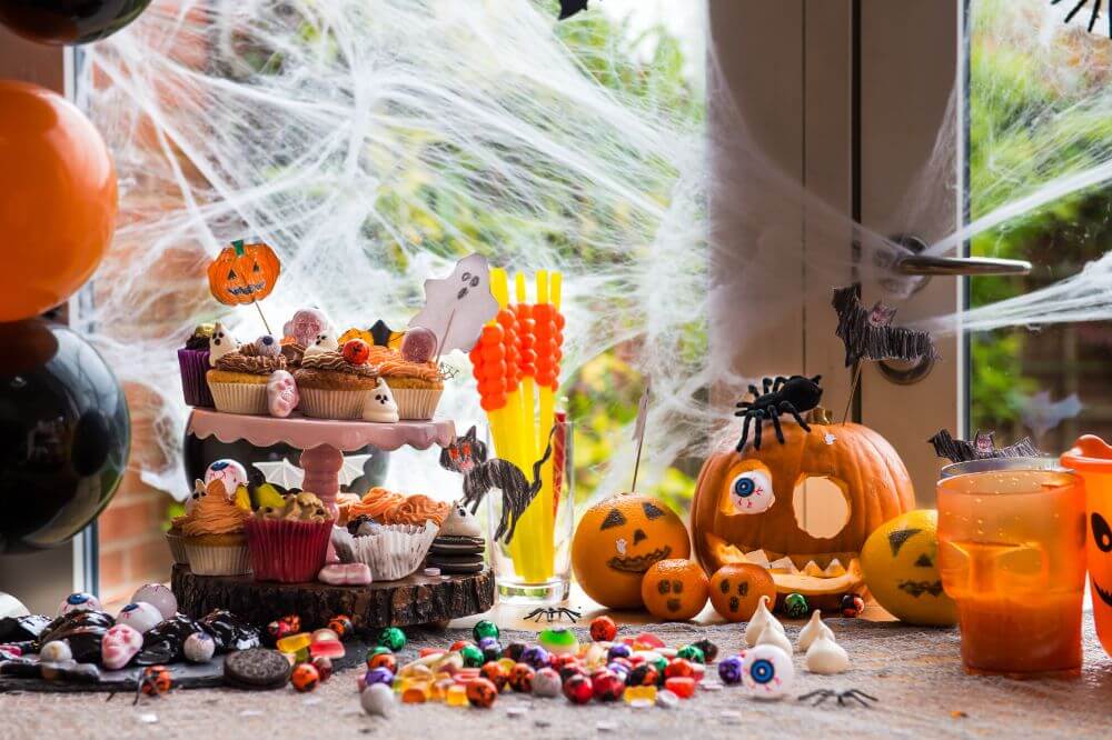 An image showing a Halloween dinner party dining room table 