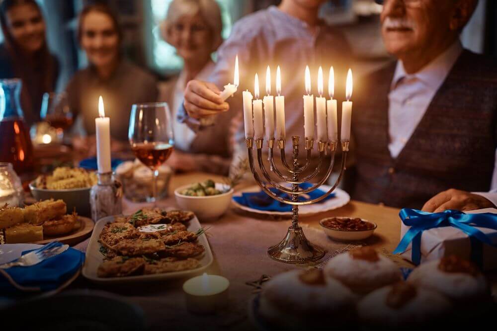 A family celebrating Hanukkah in their new home