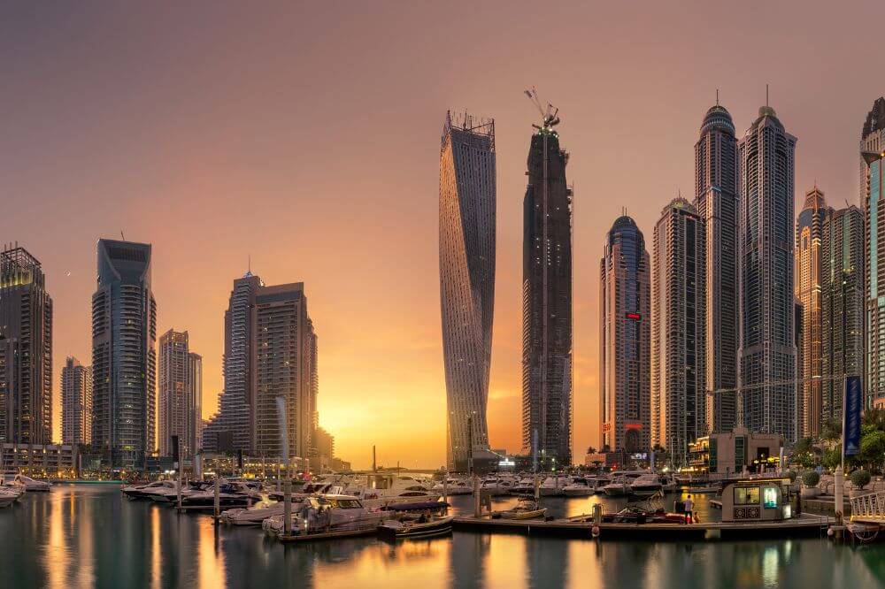 Image of Dubai skyline at sunset. 