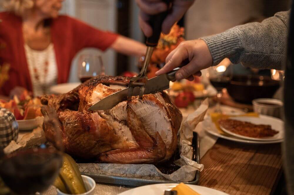 An image of people enjoying a Thanksgiving feast