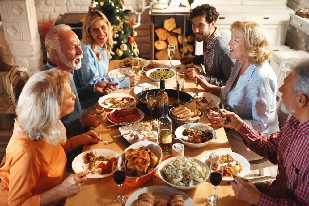 Family enjoying Thanksgiving meal in London restaurant